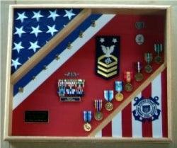 USCG Cutter Shadow Box displaying flags and medals, crafted from quality wood in Red Oak, Walnut, or Cherry finishes.