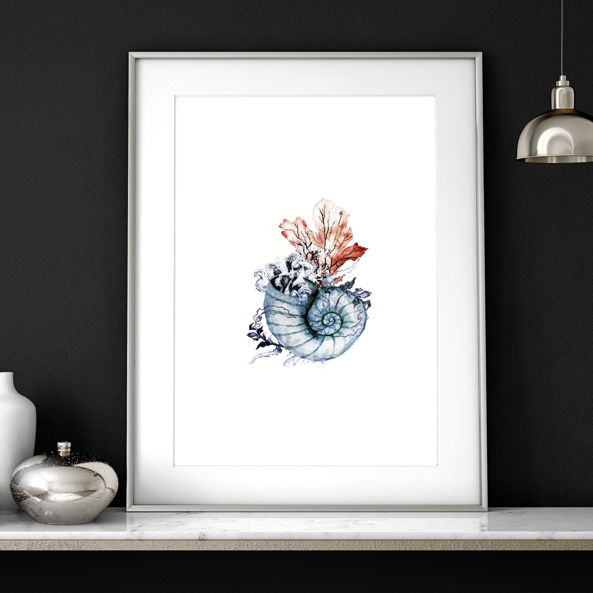 Set of 3 framed coastal wall art prints featuring beautiful watercolour seashell illustrations in soothing colors.