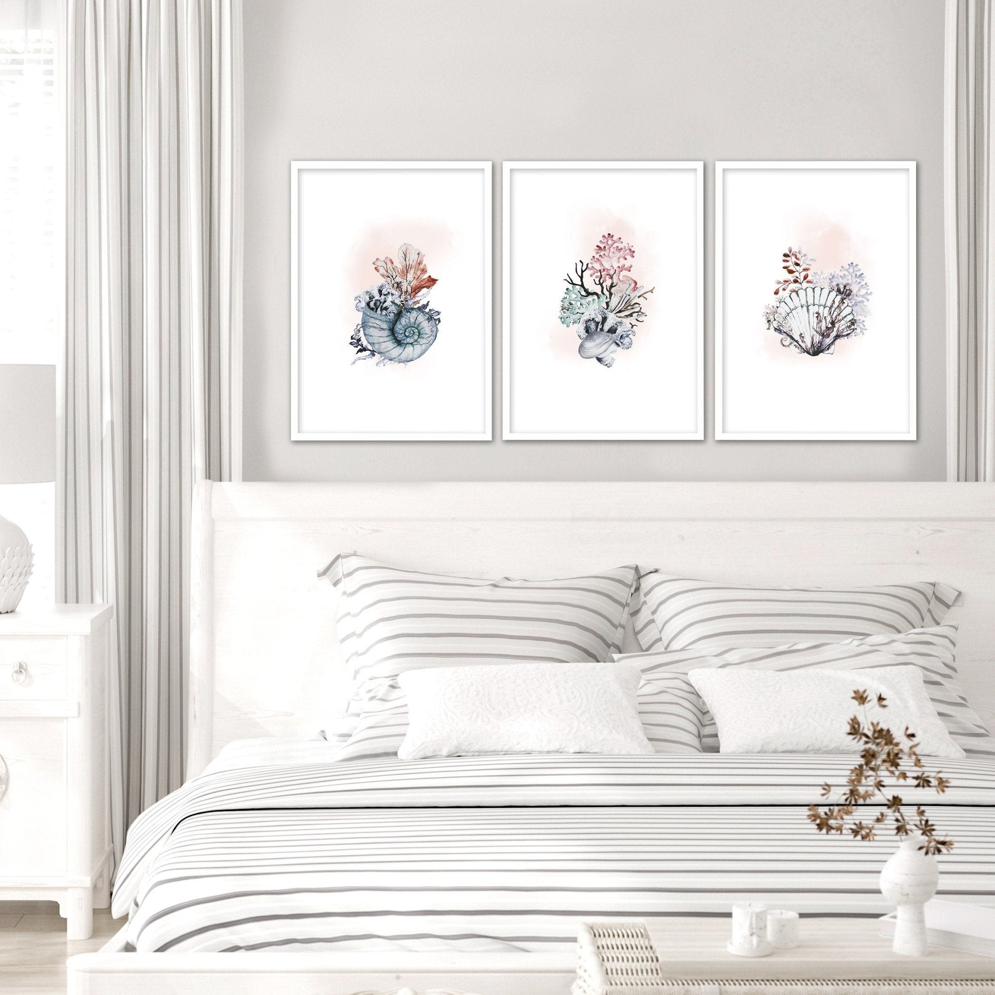 Set of 3 framed coastal wall art prints featuring beautiful watercolour seashell illustrations in soothing colors.