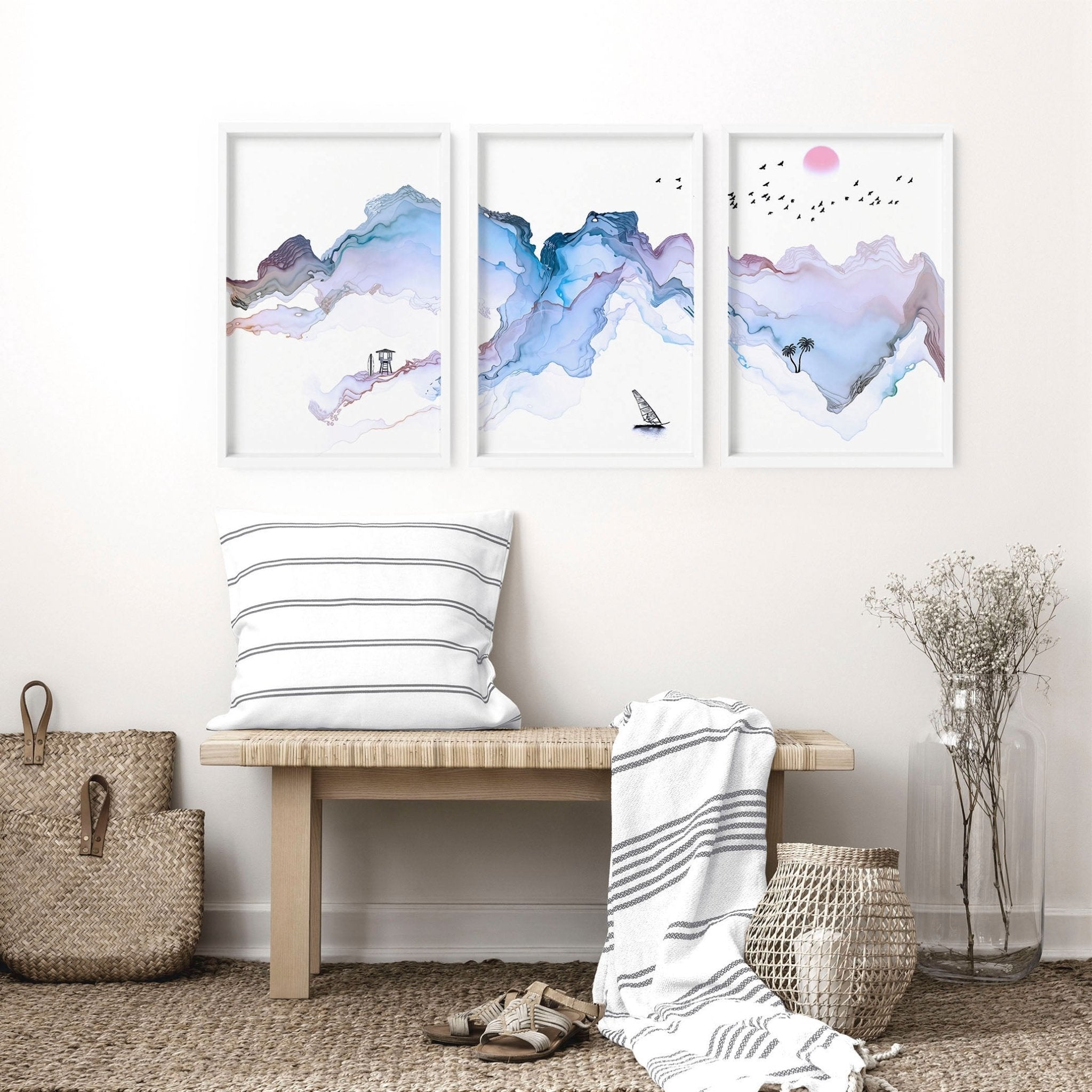 Set of 3 wall art prints featuring serene beach landscapes in pastel blue watercolor style, perfect for coastal-themed decor.