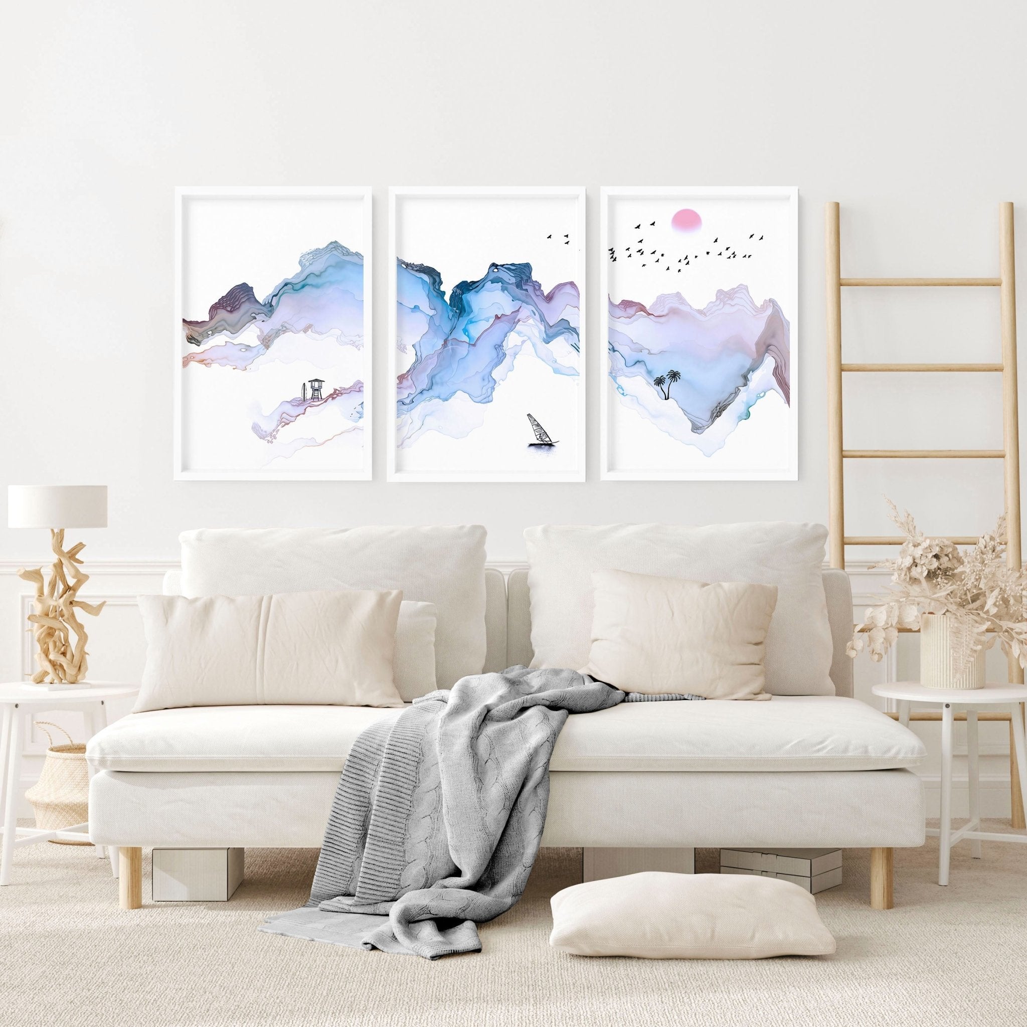 Set of 3 wall art prints featuring serene beach landscapes in pastel blue watercolor style, perfect for coastal-themed decor.