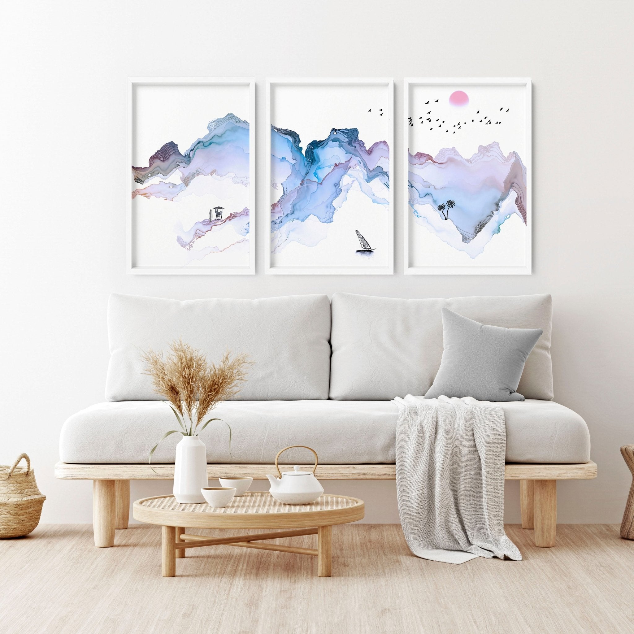 Set of 3 wall art prints featuring serene beach landscapes in pastel blue watercolor style, perfect for coastal-themed decor.