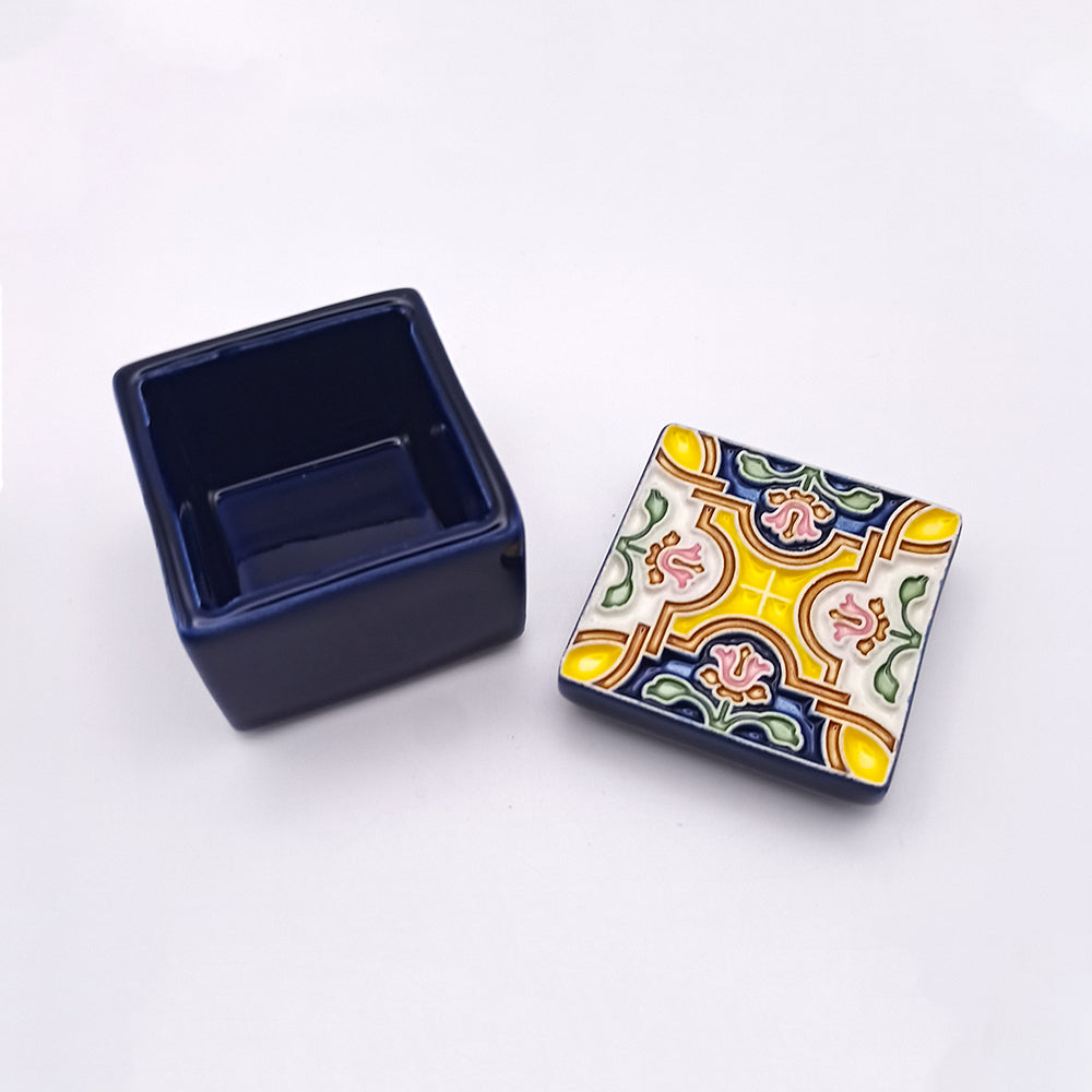 A beautifully handcrafted Coimbra Ceramic Box featuring intricate designs and vibrant colors, perfect for storage or decoration.