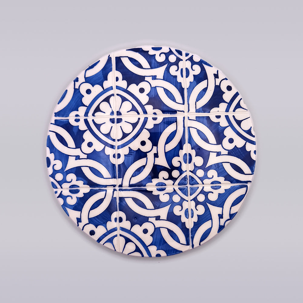 Coimbra Ceramic Countertop Hot Pads featuring unique hand-painted designs, perfect for protecting kitchen surfaces.