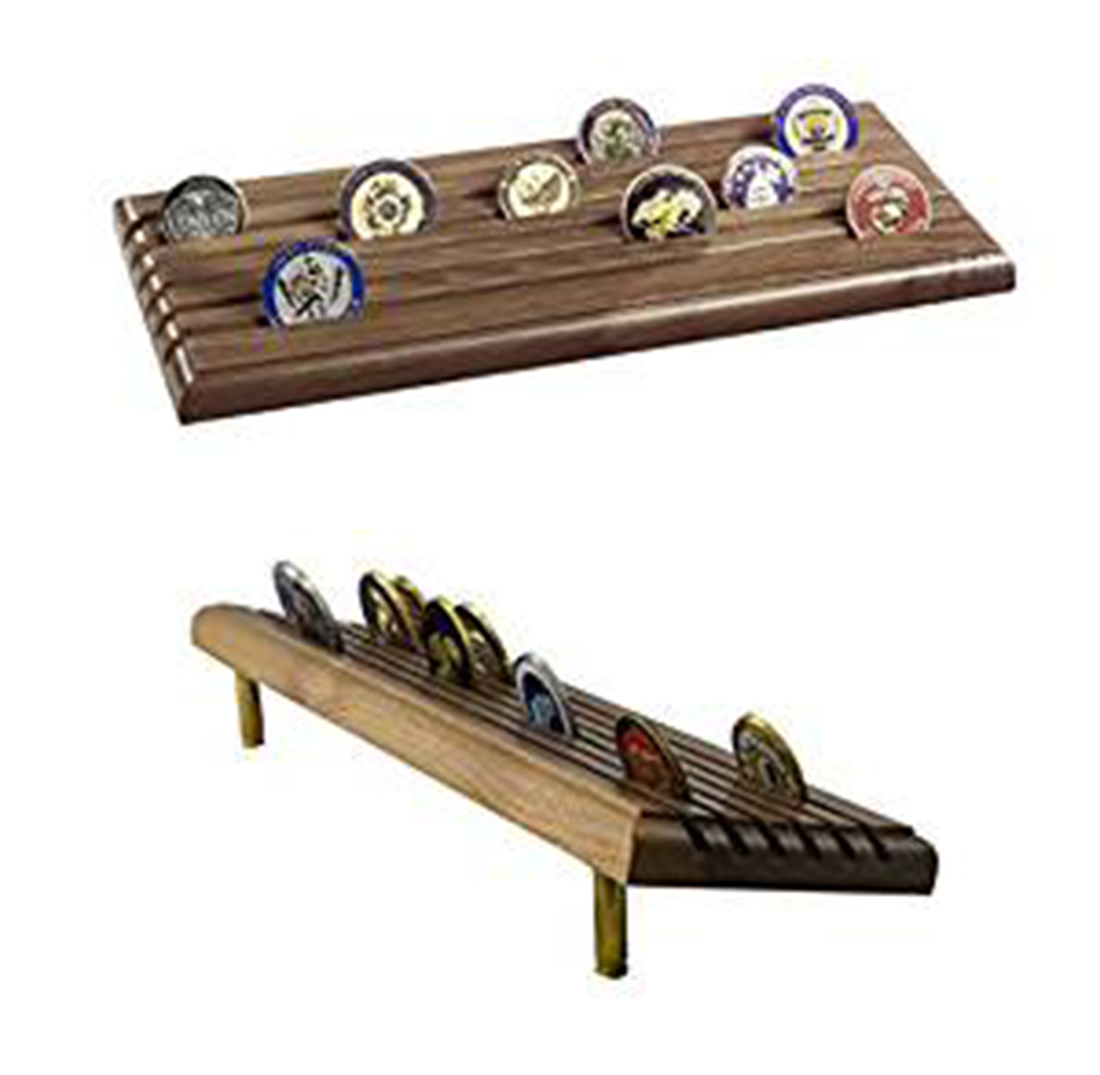 A tiered coin display rack made in the USA, featuring military shell casings at the base, designed to hold and showcase challenge coins.