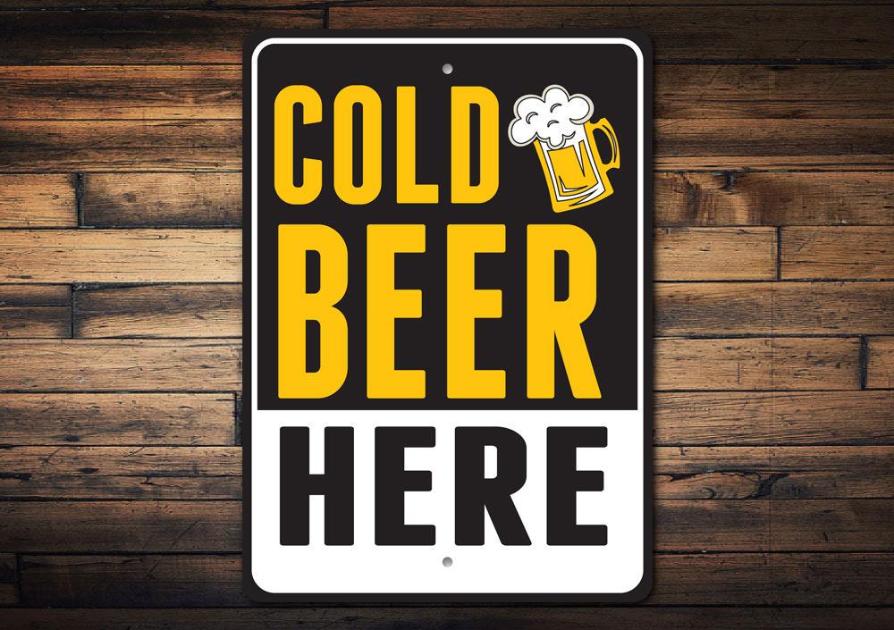 Cold Beer Here Sign made of durable aluminum, featuring vibrant colors and a fun design, perfect for man caves and kitchens.