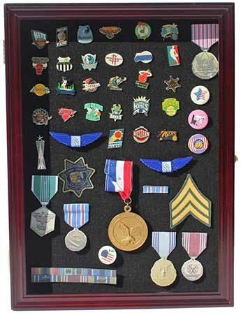 Collector Medal/Lapel Pin Display Case Holder with black matted background, showcasing various pins and medals.