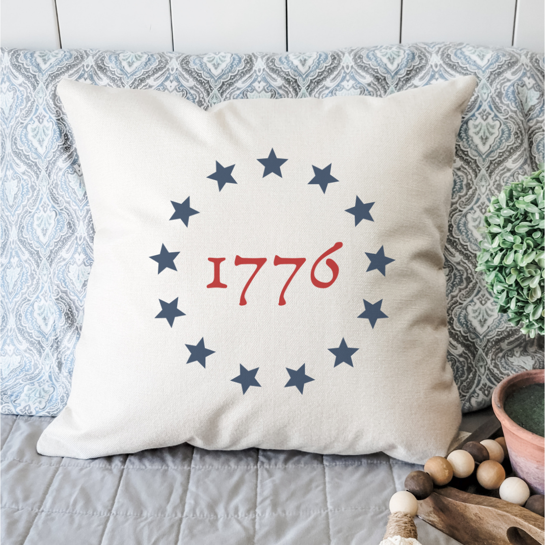 Colonial Star 1776 Pillow Cover featuring a light beige background with a patriotic star design, perfect for home decor.