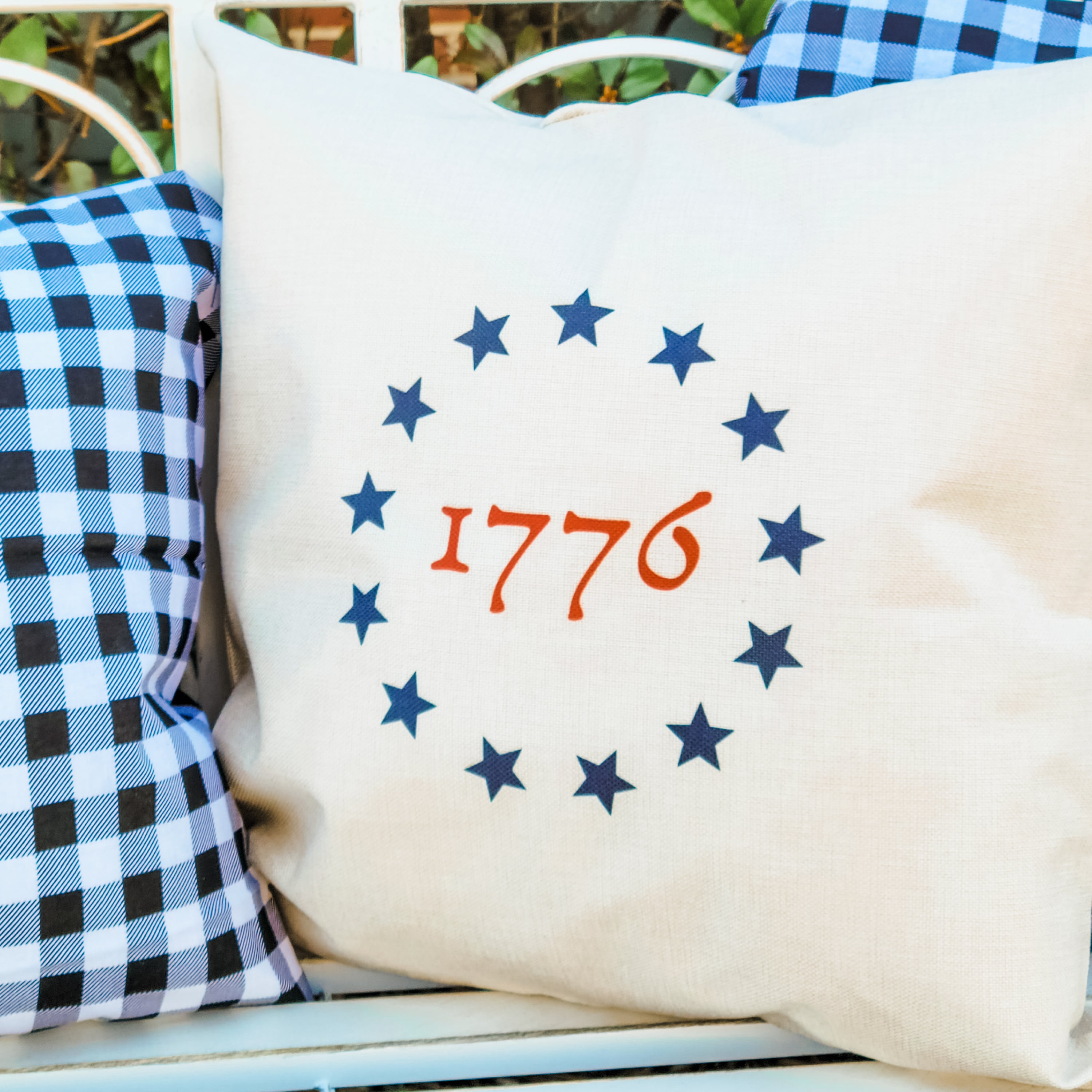 Colonial Star 1776 Pillow Cover featuring a light beige background with a patriotic star design, perfect for home decor.