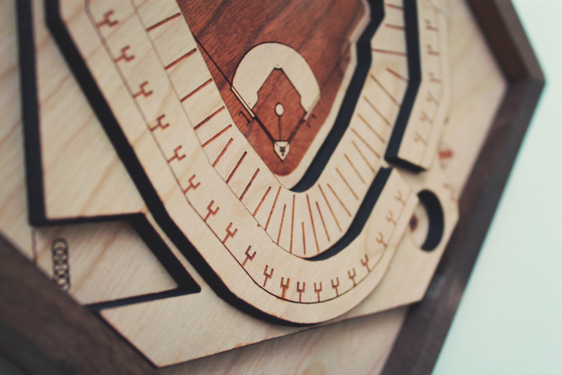 Handcrafted wooden representation of Comerica Park featuring tigers, ferris wheel, and merry-go-round, framed in black walnut.