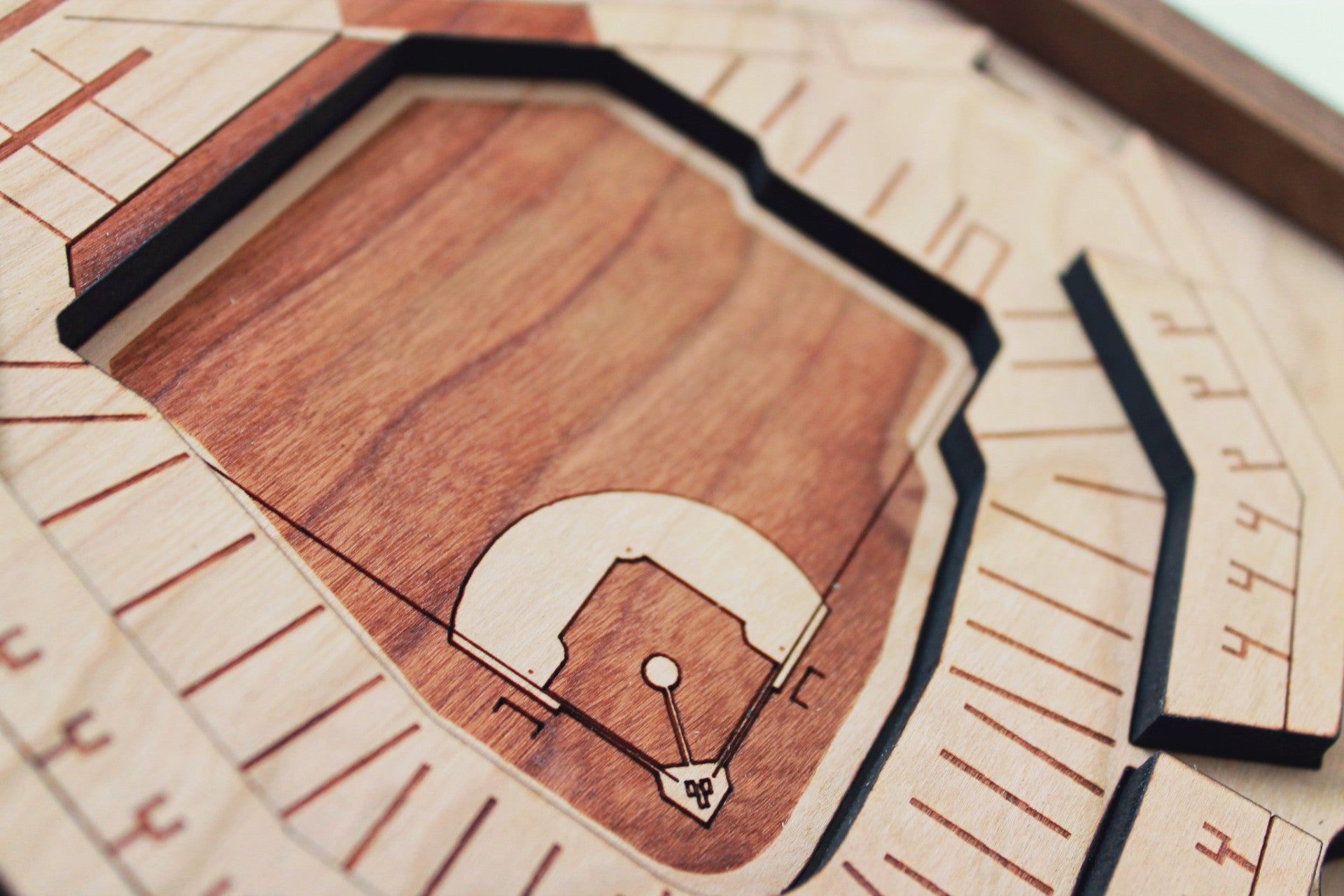 Handcrafted wooden representation of Comerica Park featuring tigers, ferris wheel, and merry-go-round, framed in black walnut.