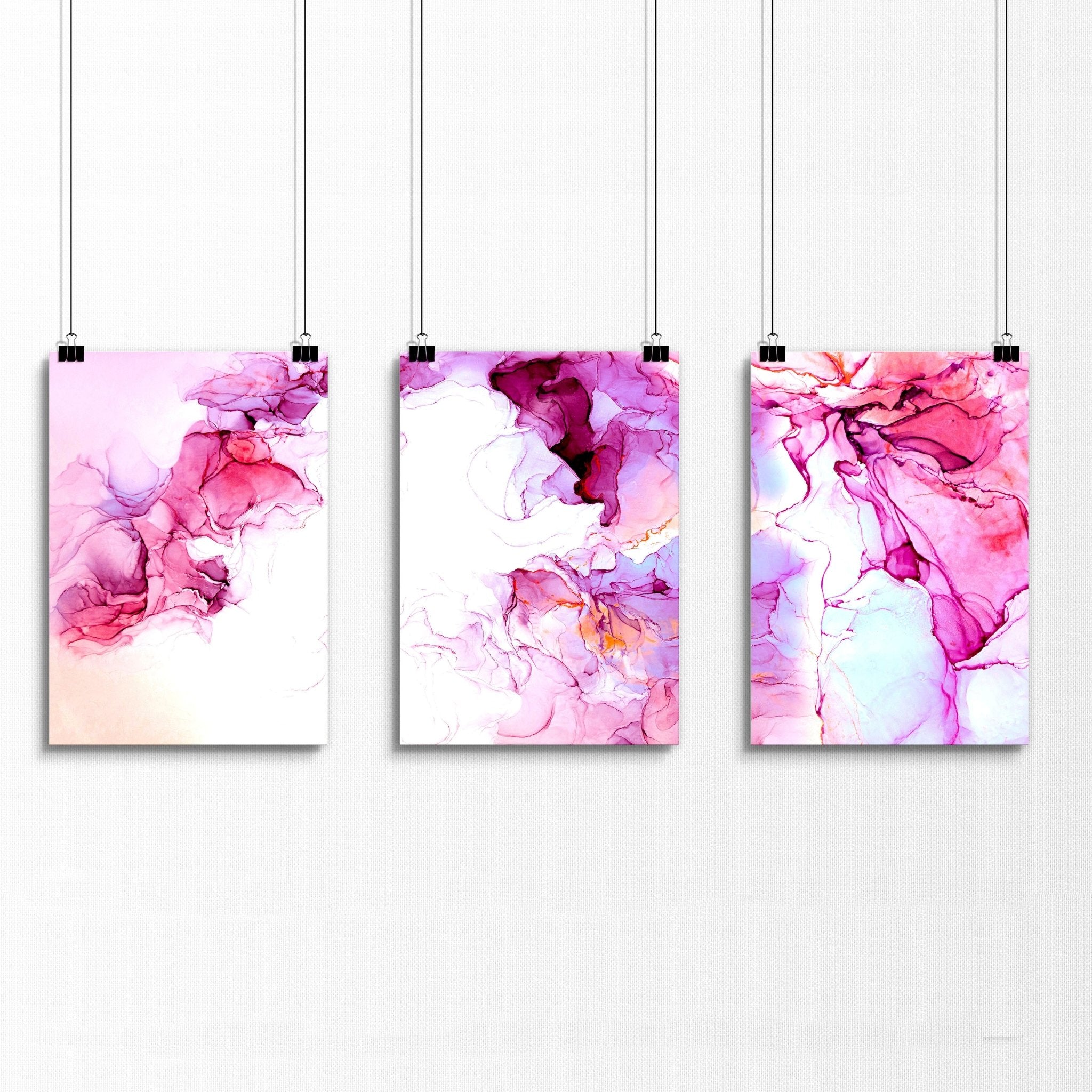 Set of 3 contemporary wall art prints featuring vibrant magenta alcohol ink designs, perfect for home or office decor.