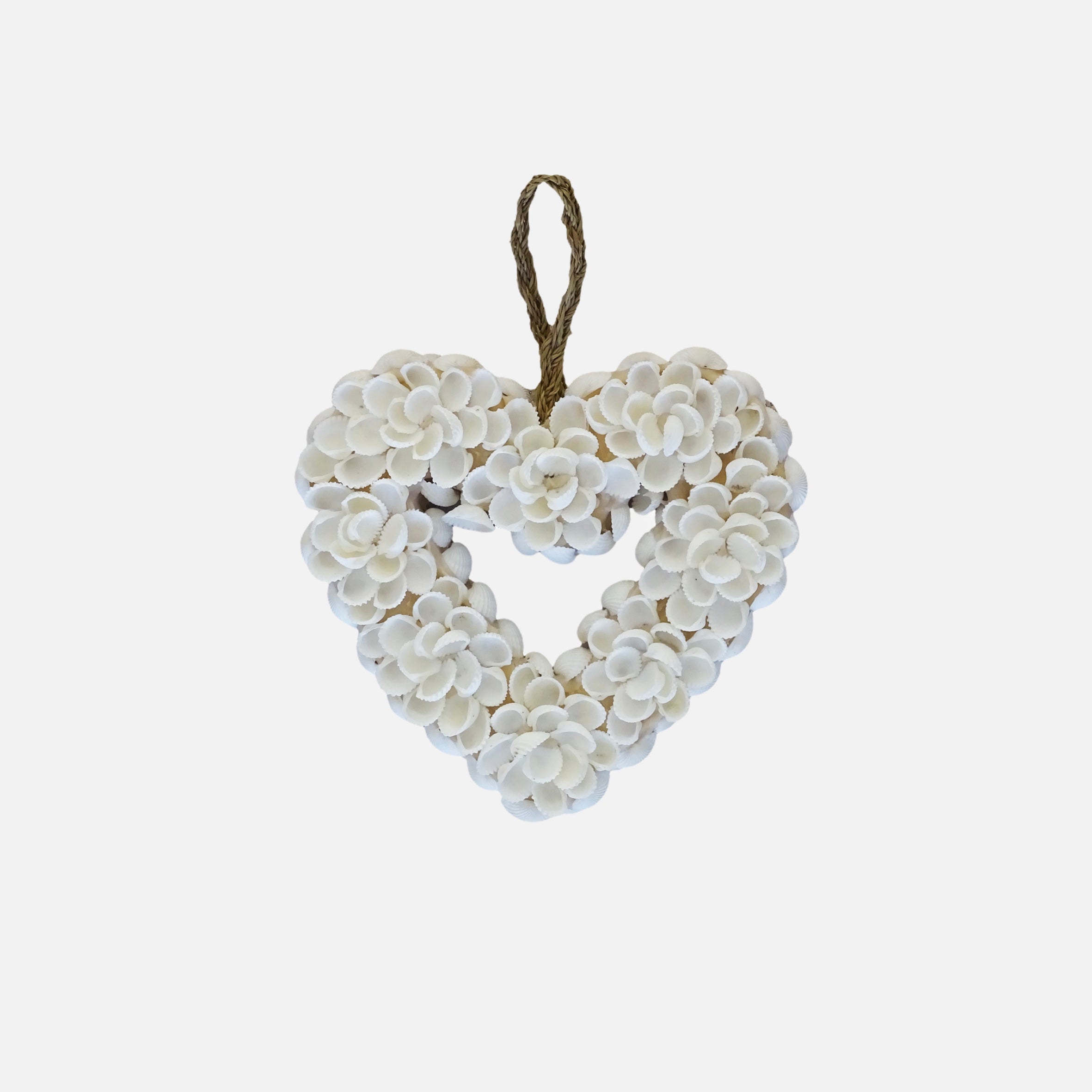 Handmade heart wall decoration made from natural shells, perfect for home decor.