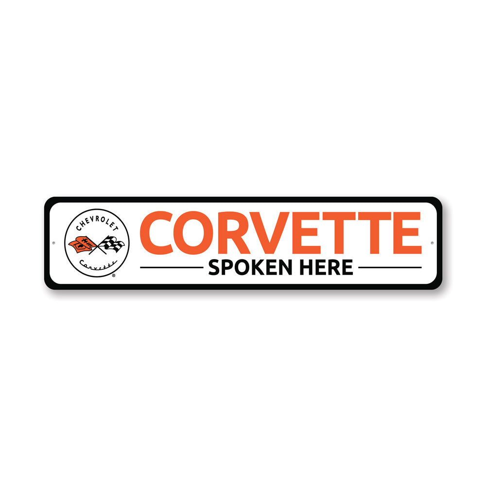 Corvette Spoken Here metal sign, featuring vibrant colors and a sleek design, perfect for car enthusiasts' decor.