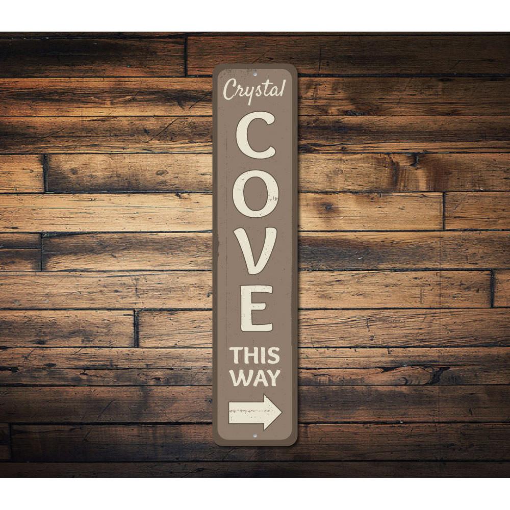 A customizable Cove Sign made of high-quality aluminum, featuring pre-drilled holes for easy mounting, showcasing a personalized design.