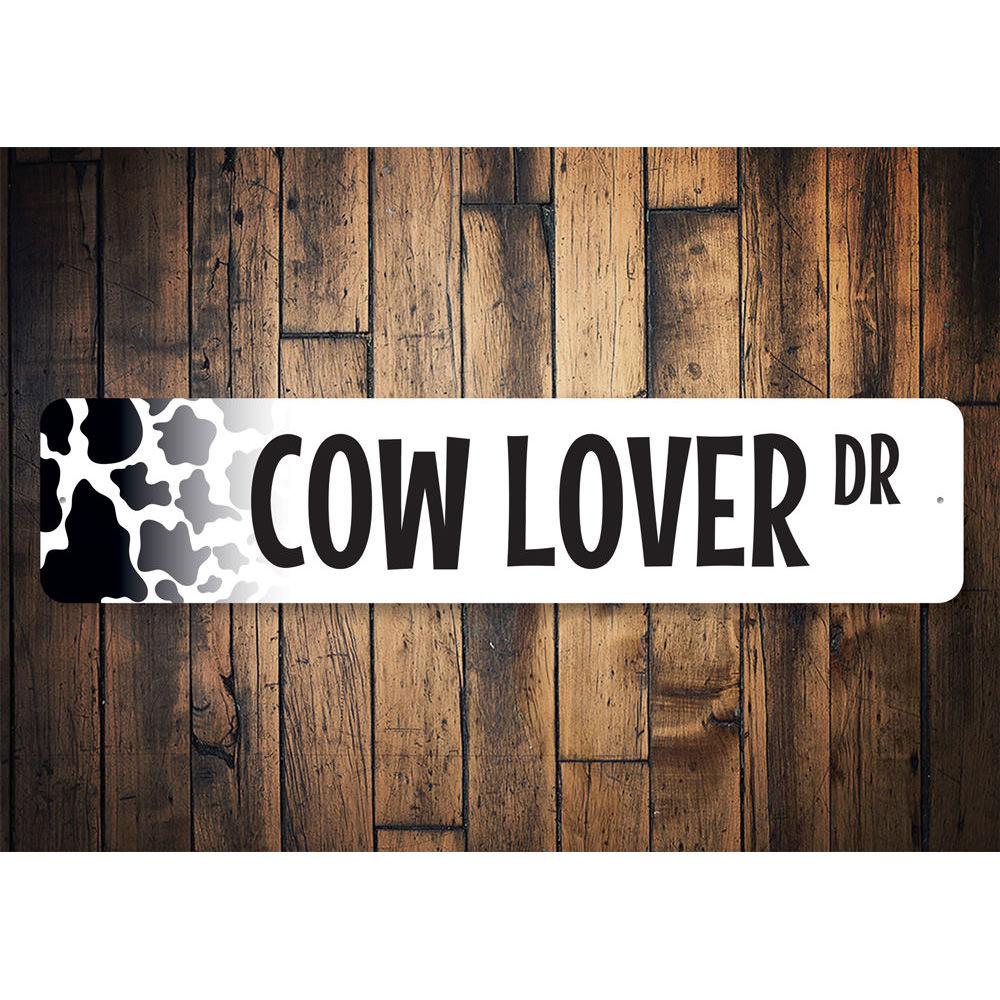 A decorative Cow Lover Street Sign made of aluminum, featuring a charming cow design, perfect for home decor.