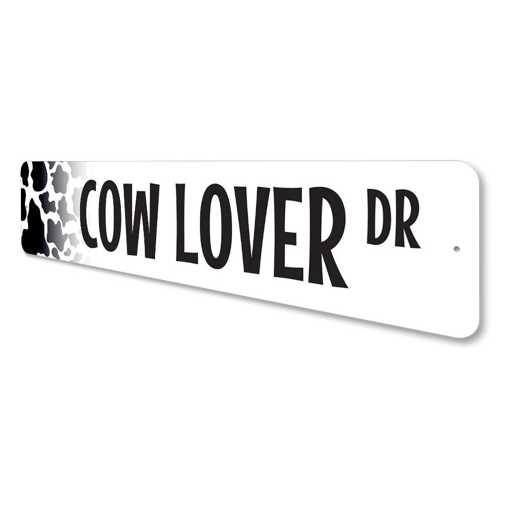 A decorative Cow Lover Street Sign made of aluminum, featuring a charming cow design, perfect for home decor.