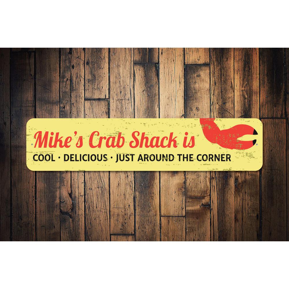 A decorative Crab Claw Sign made of high-quality aluminum, featuring a vibrant design perfect for beach-themed decor.