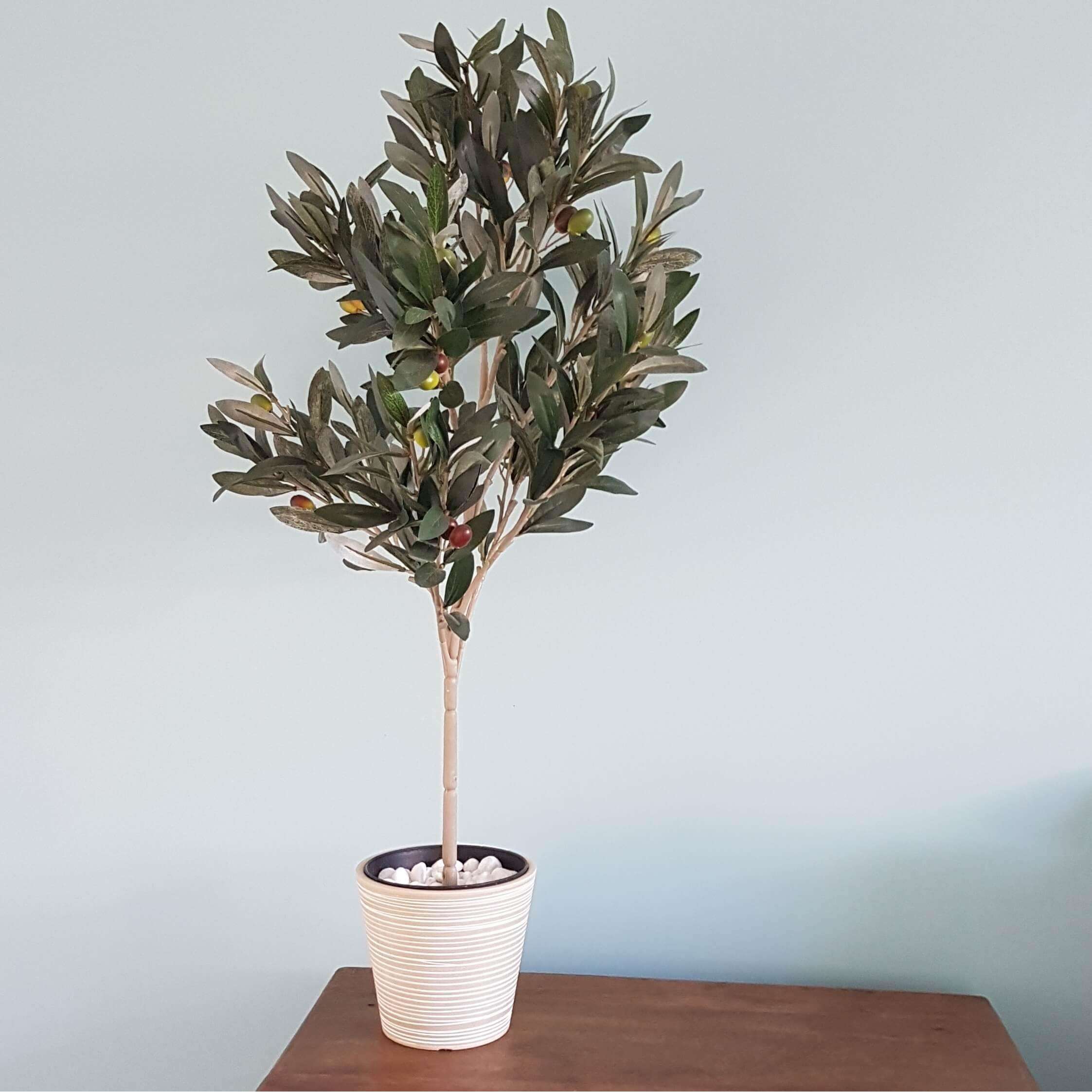 A decorative cream and white engraved pot made from recycled materials, featuring intricate hand-engraved designs, perfect for indoor or outdoor use.