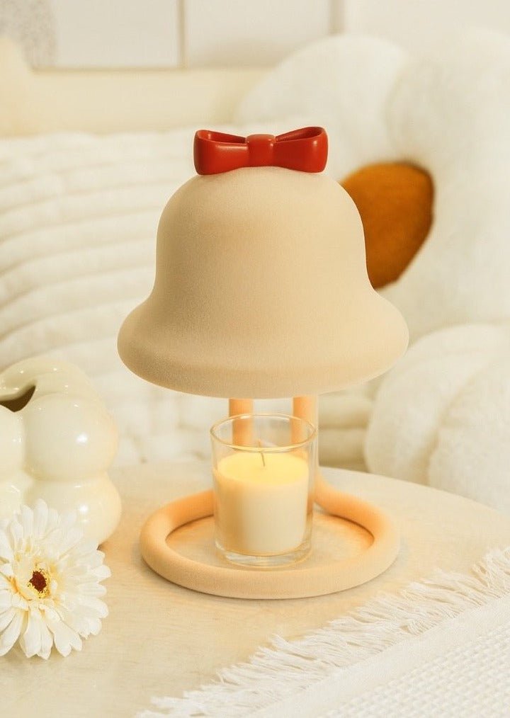 Cute whimsical bell candle warmer lamp designed for large candles, featuring a playful bell shape and warm light.