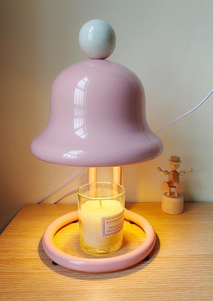 Cute whimsical bell candle warmer lamp designed for large candles, featuring a playful bell shape and warm light.