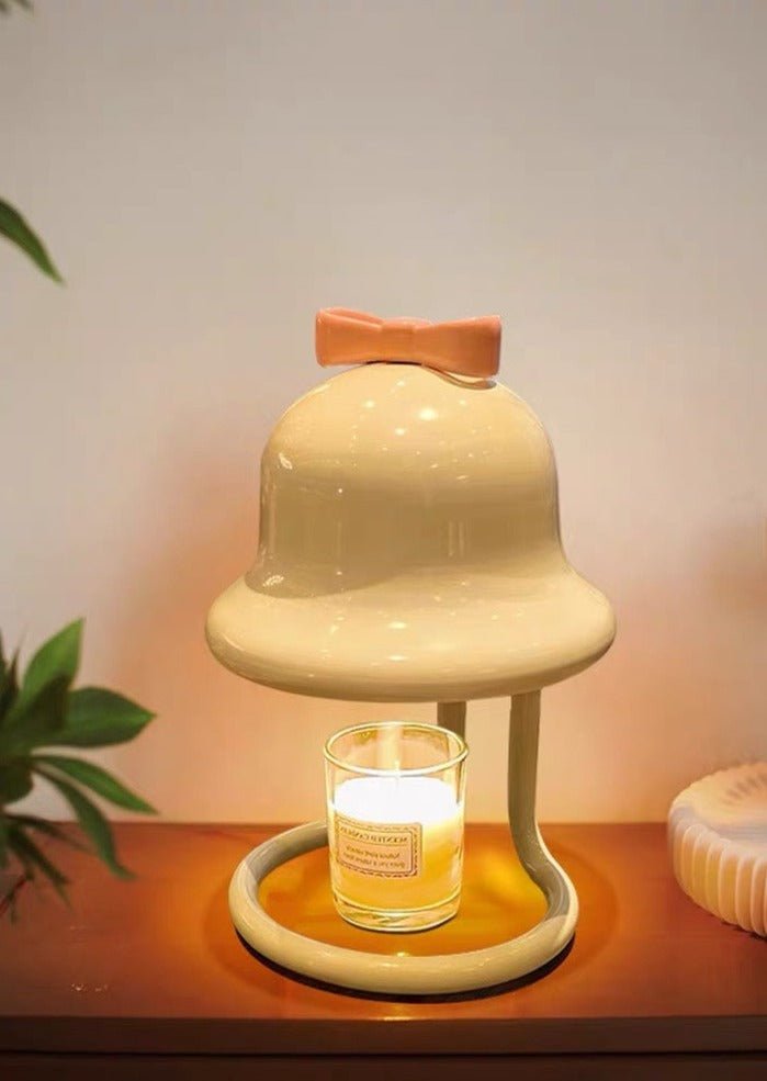 Cute whimsical bell candle warmer lamp designed for large candles, featuring a playful bell shape and warm light.