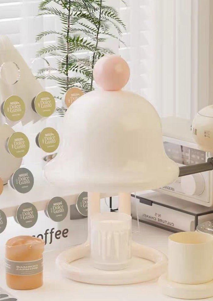 Cute whimsical bell candle warmer lamp designed for large candles, featuring a playful bell shape and warm light.