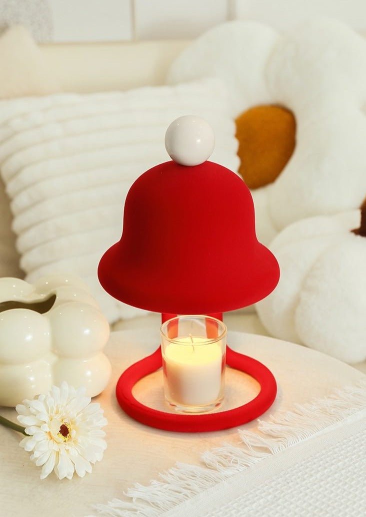 Cute whimsical bell candle warmer lamp designed for large candles, featuring a playful bell shape and warm light.