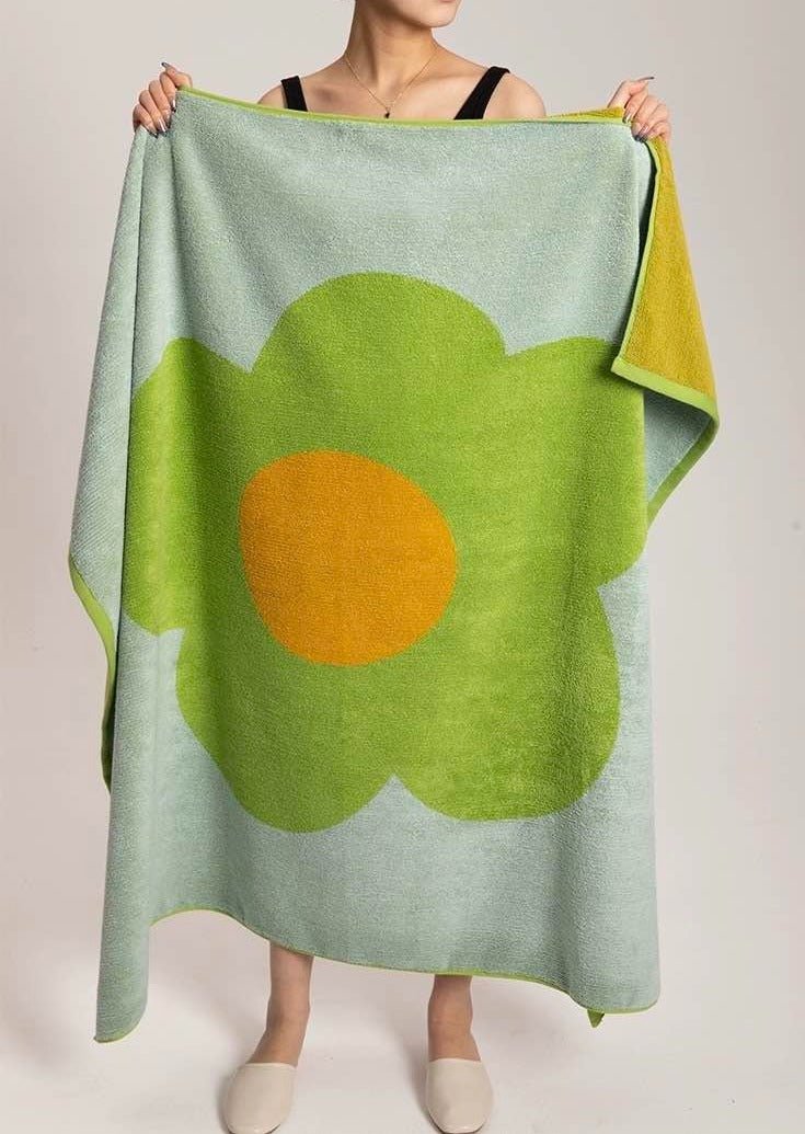 Cute Whimsical Sunflower Bath Towel featuring vibrant sunflower prints on soft cotton fabric.