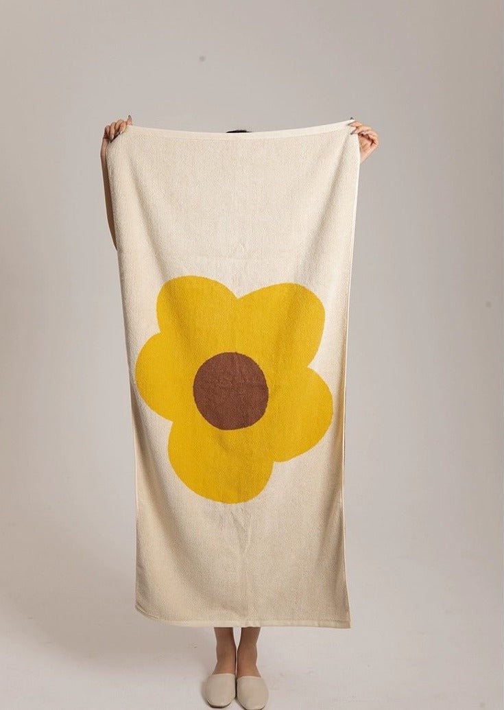 Cute Whimsical Sunflower Bath Towel featuring vibrant sunflower prints on soft cotton fabric.