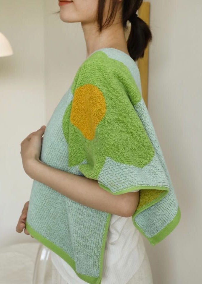 Cute Whimsical Sunflower Bath Towel featuring vibrant sunflower prints on soft cotton fabric.