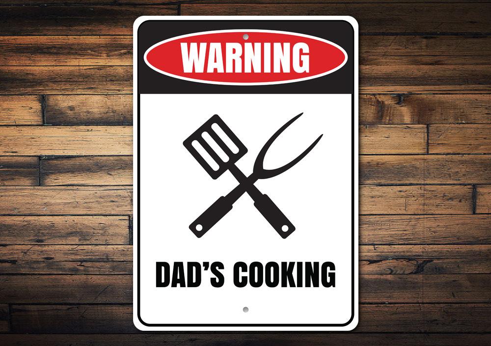 Dads Cooking Sign made of high-quality aluminum, featuring a humorous design perfect for kitchens and man caves.