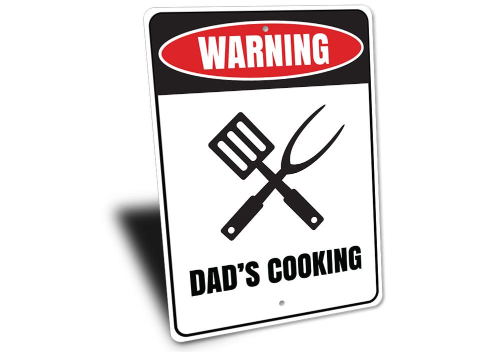 Dads Cooking Sign made of high-quality aluminum, featuring a humorous design perfect for kitchens and man caves.