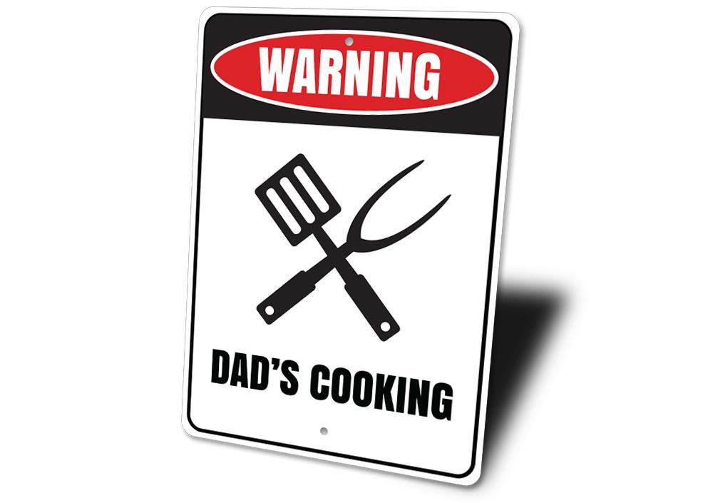 Dads Cooking Sign made of high-quality aluminum, featuring a humorous design perfect for kitchens and man caves.