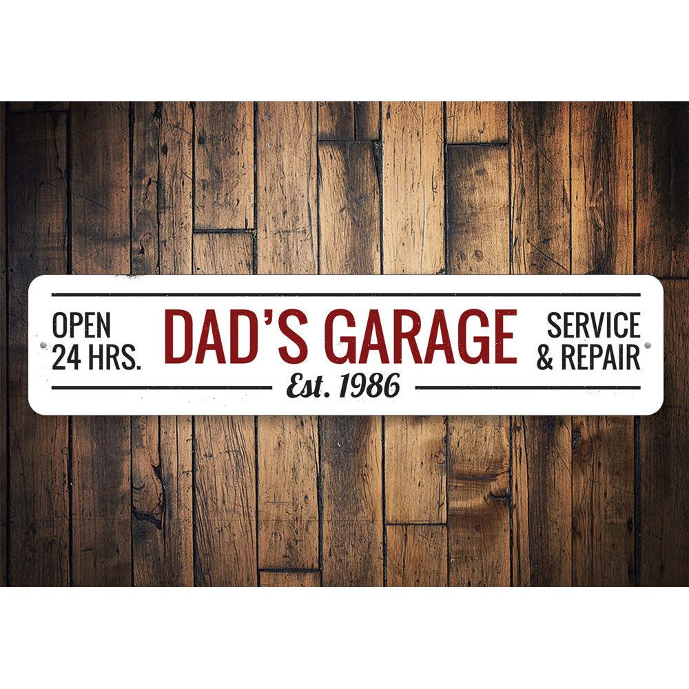 A decorative Dads Garage Sign made of high-quality aluminum, featuring customizable text and pre-drilled holes for easy mounting.