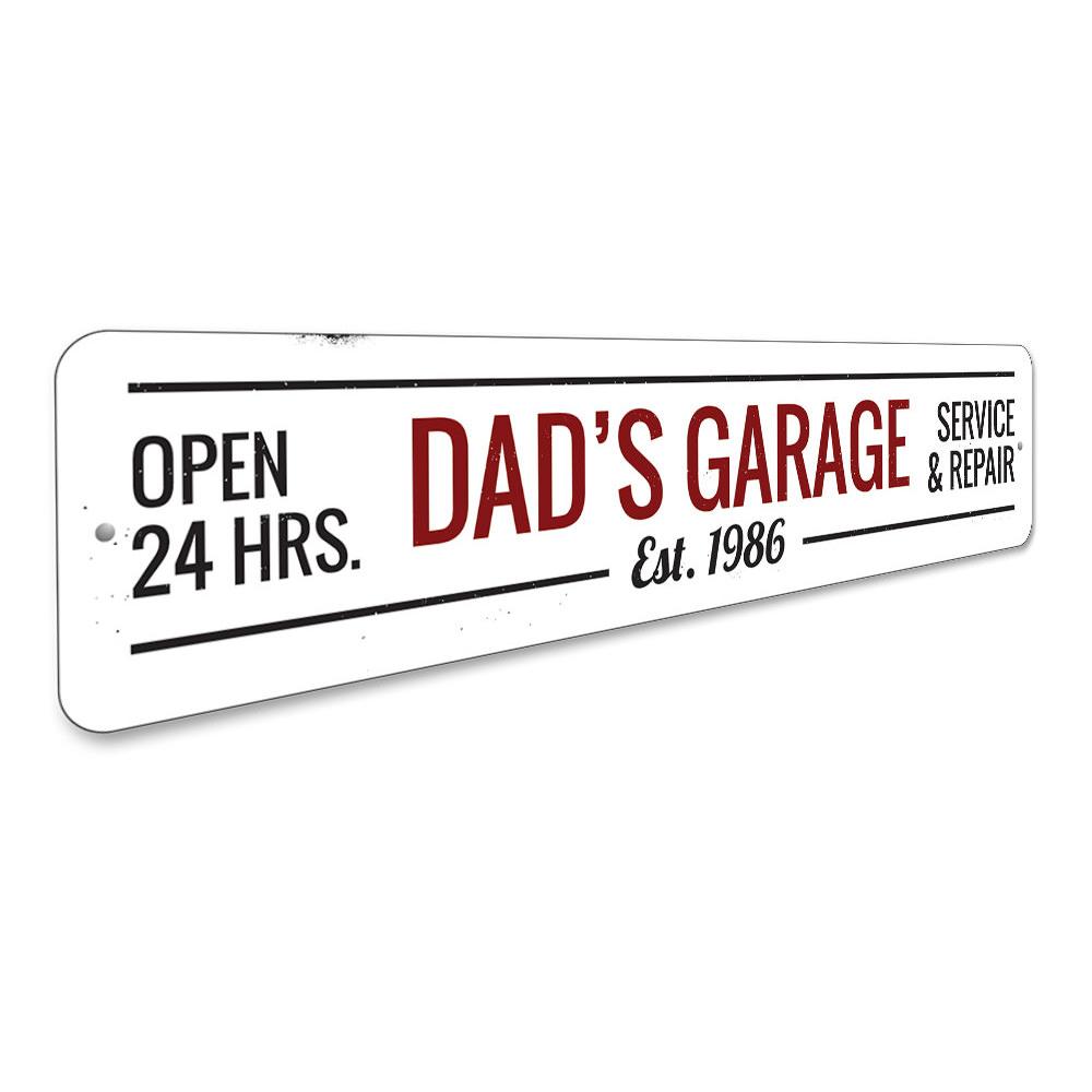 A decorative Dads Garage Sign made of high-quality aluminum, featuring customizable text and pre-drilled holes for easy mounting.