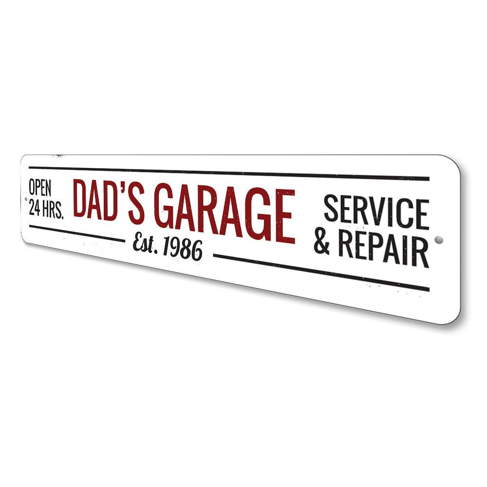 A decorative Dads Garage Sign made of high-quality aluminum, featuring customizable text and pre-drilled holes for easy mounting.