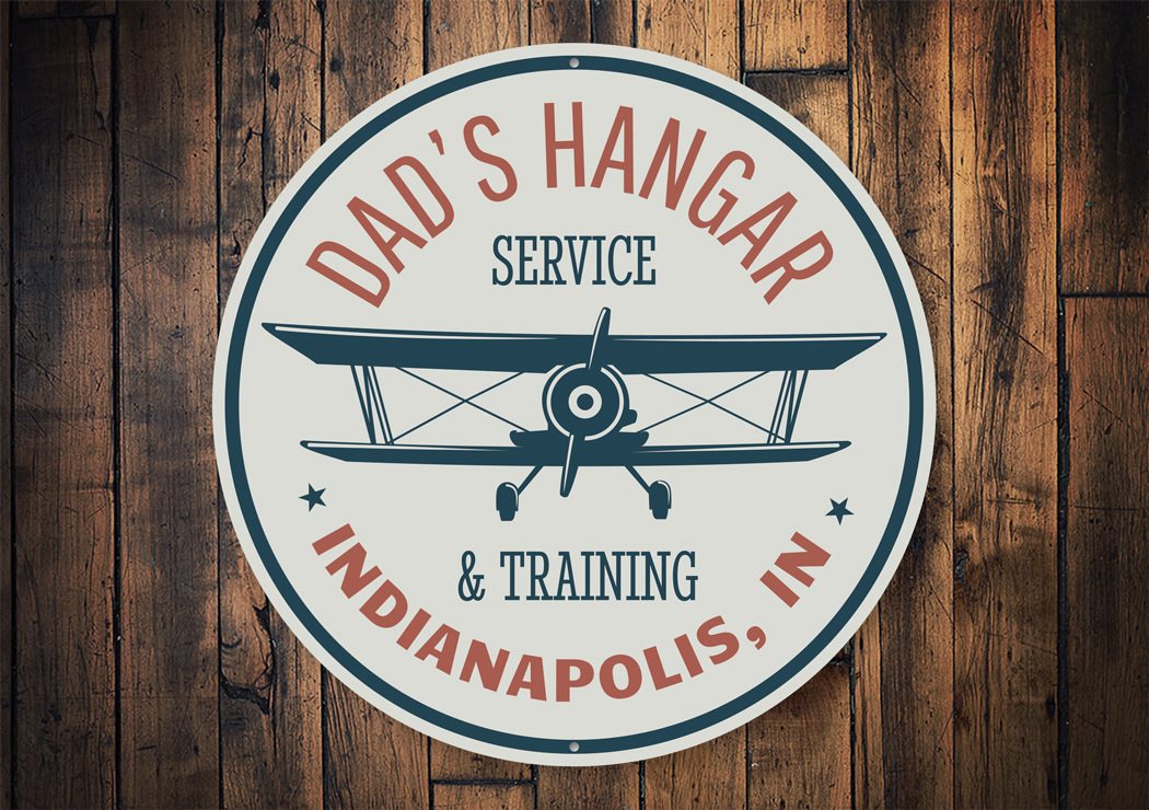 Dad's Hangar Service and Training City State Sign made of durable aluminum, featuring customizable text and pre-drilled holes for easy mounting.