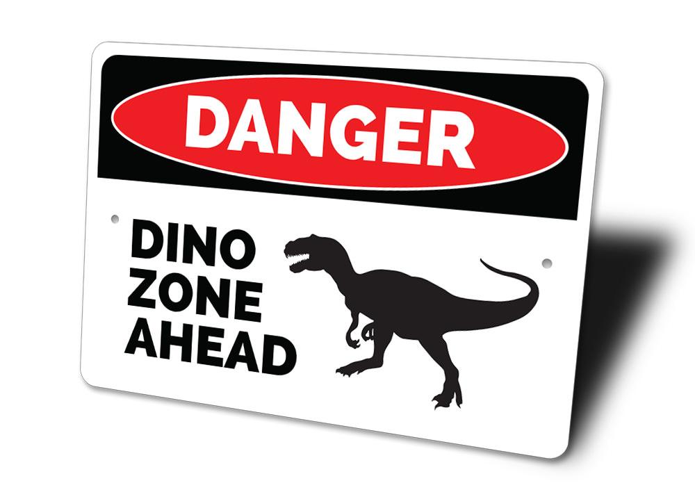 A colorful Danger Dino Zone Ahead Sign featuring playful dinosaur graphics, perfect for children's rooms.