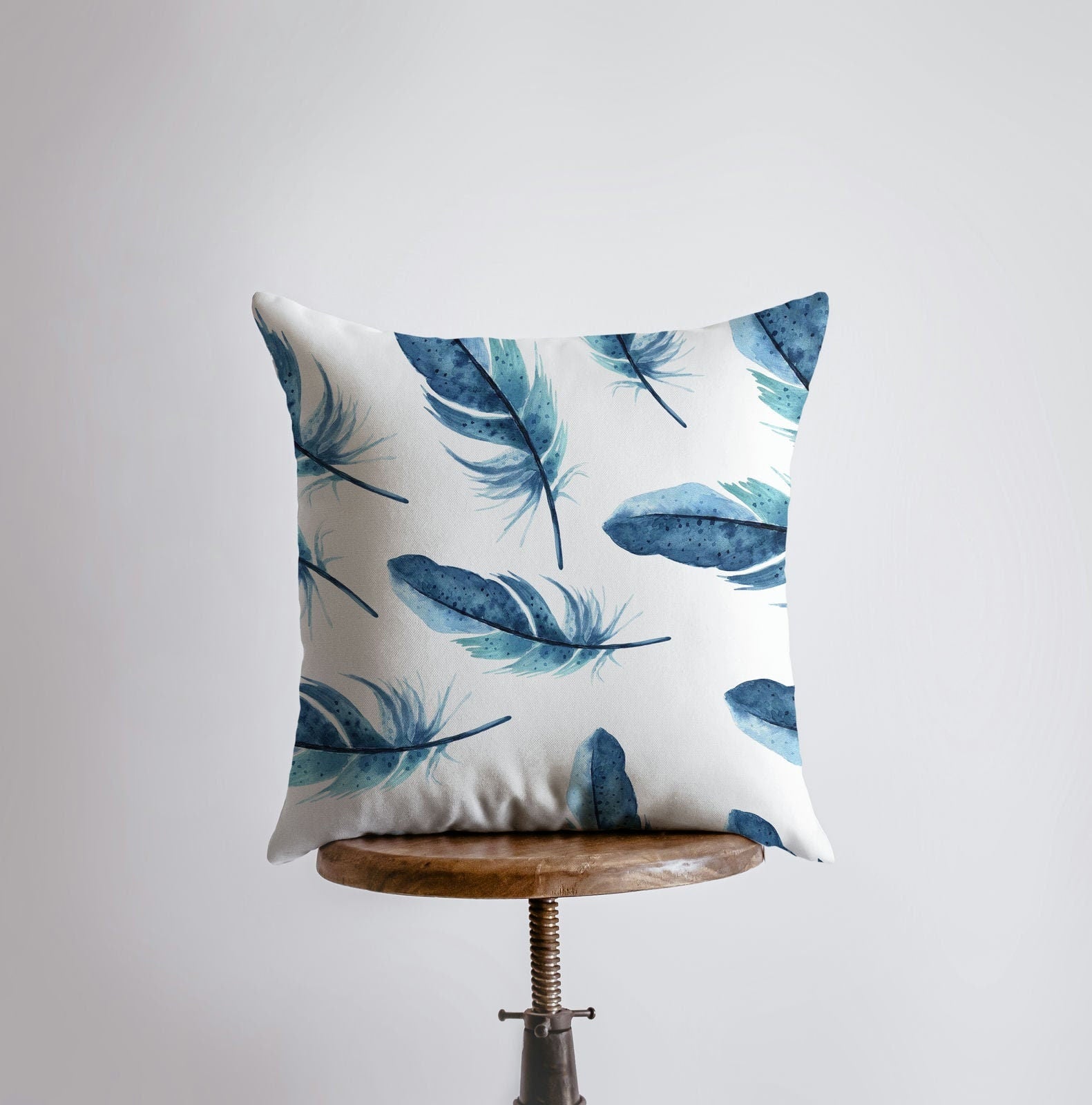 Dark blue feather patterned pillow cover, showcasing a unique design for bird lovers, with a concealed zipper and double-sided print.