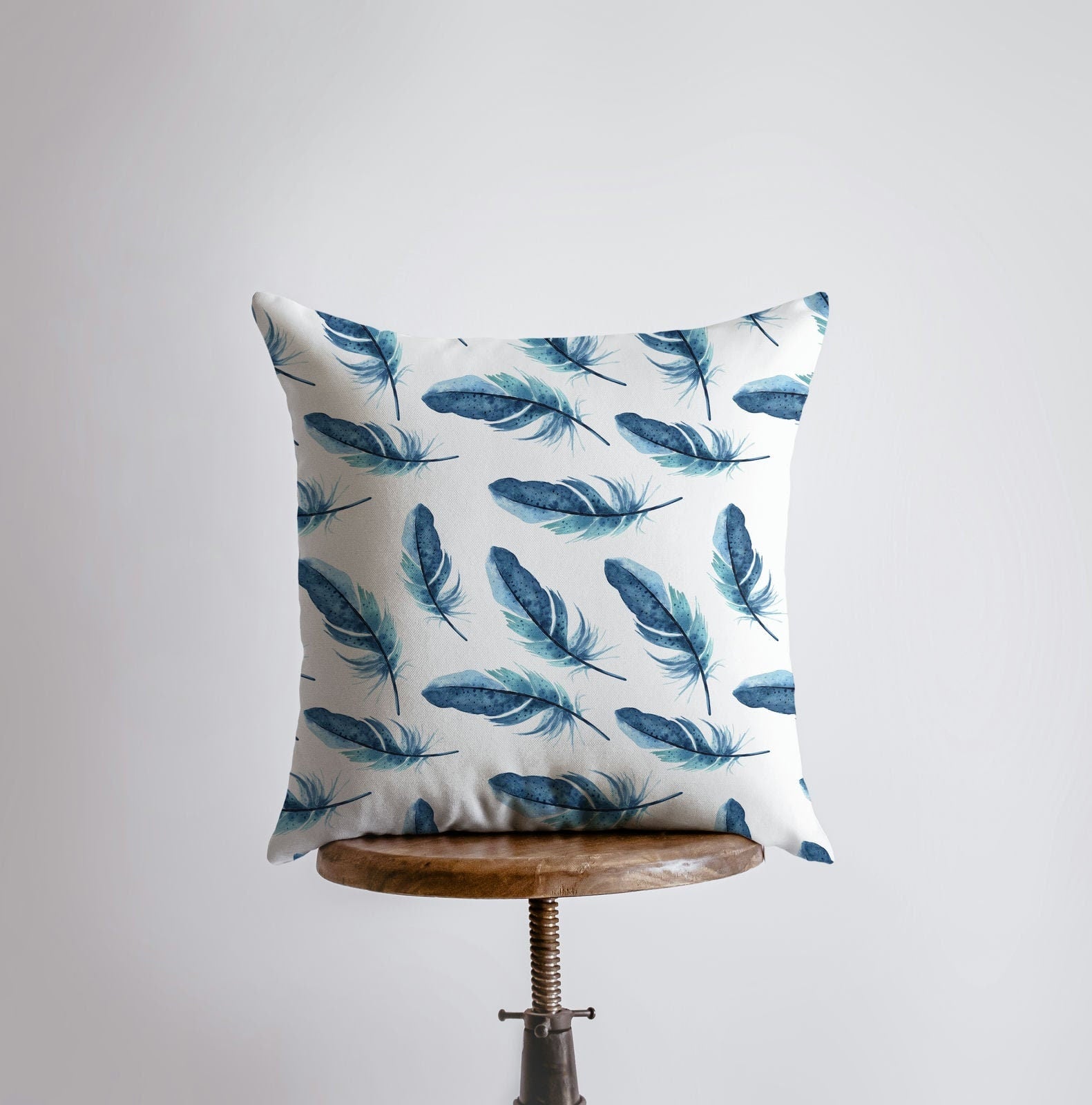 Dark blue feather patterned pillow cover, showcasing a unique design for bird lovers, with a concealed zipper and double-sided print.