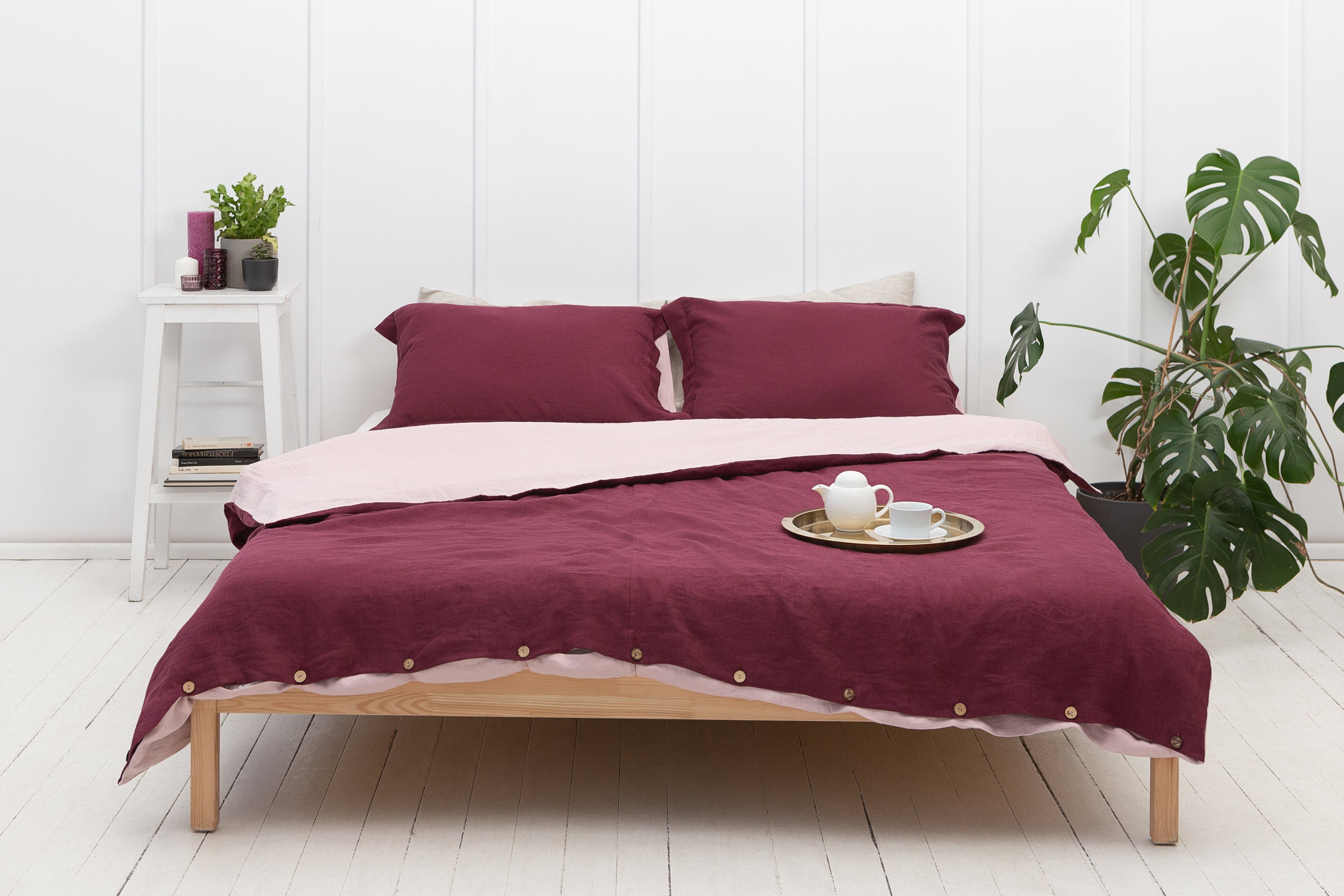 Dark Plum and Pale Pink double-sided linen bedding set featuring a duvet cover, fitted sheet, and pillowcases with coconut buttons.