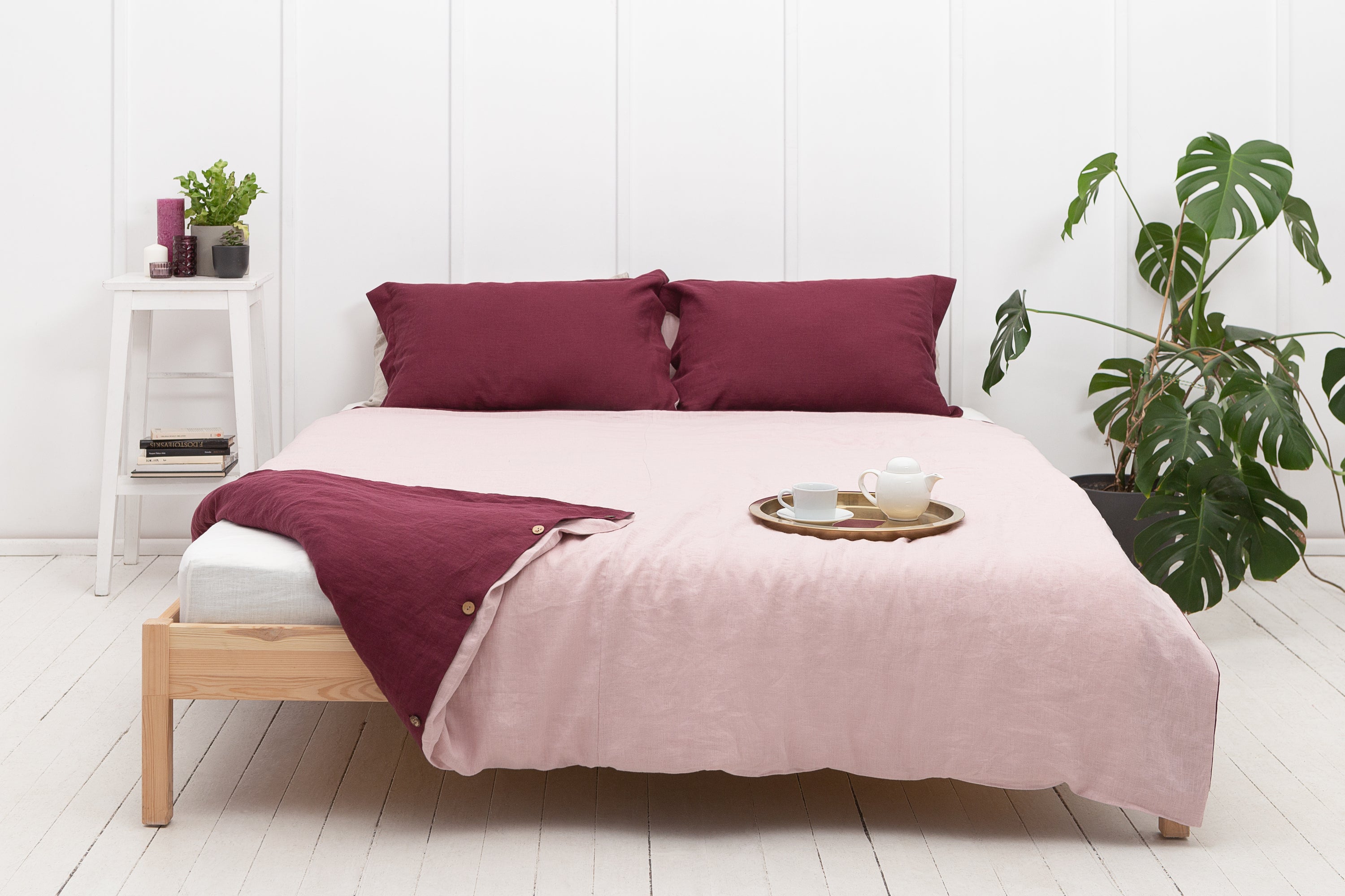 Dark Plum and Pale Pink double-sided linen bedding set featuring a duvet cover, fitted sheet, and pillowcases with coconut buttons.