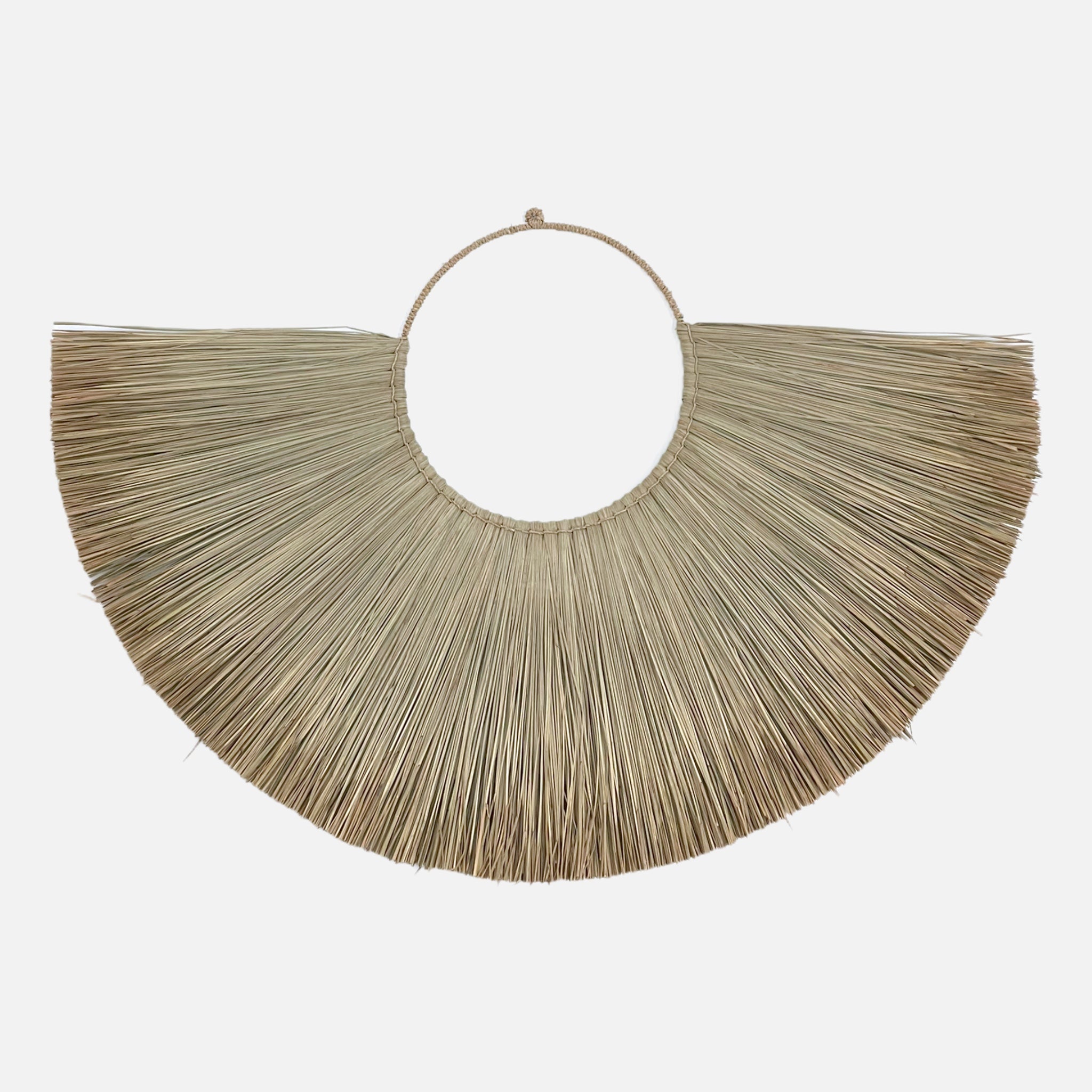 Jingga Allang wall decoration made of natural grass, showcasing a bohemian design perfect for home decor.