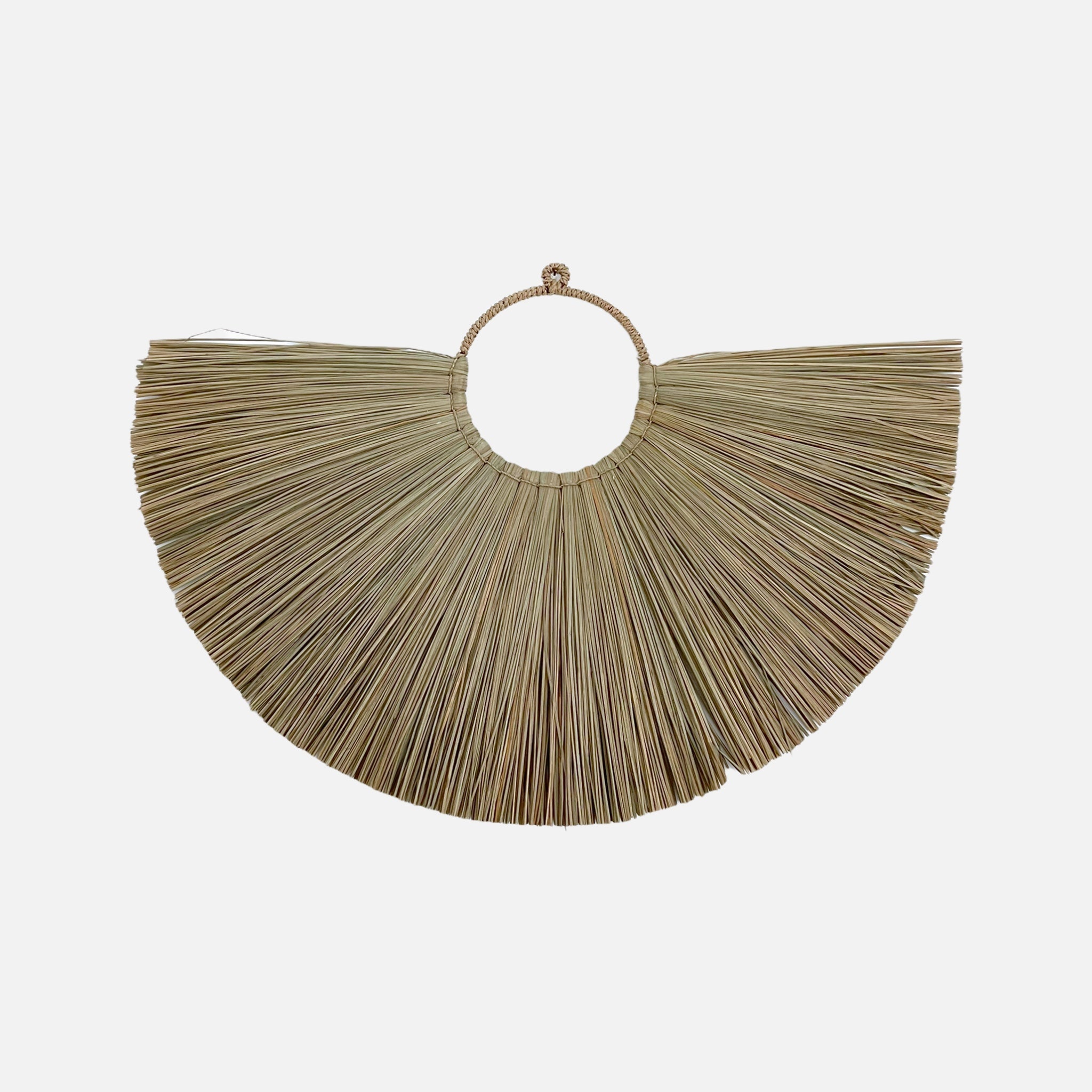 Jingga Allang wall decoration made of natural grass, showcasing intricate weaving and bohemian style.