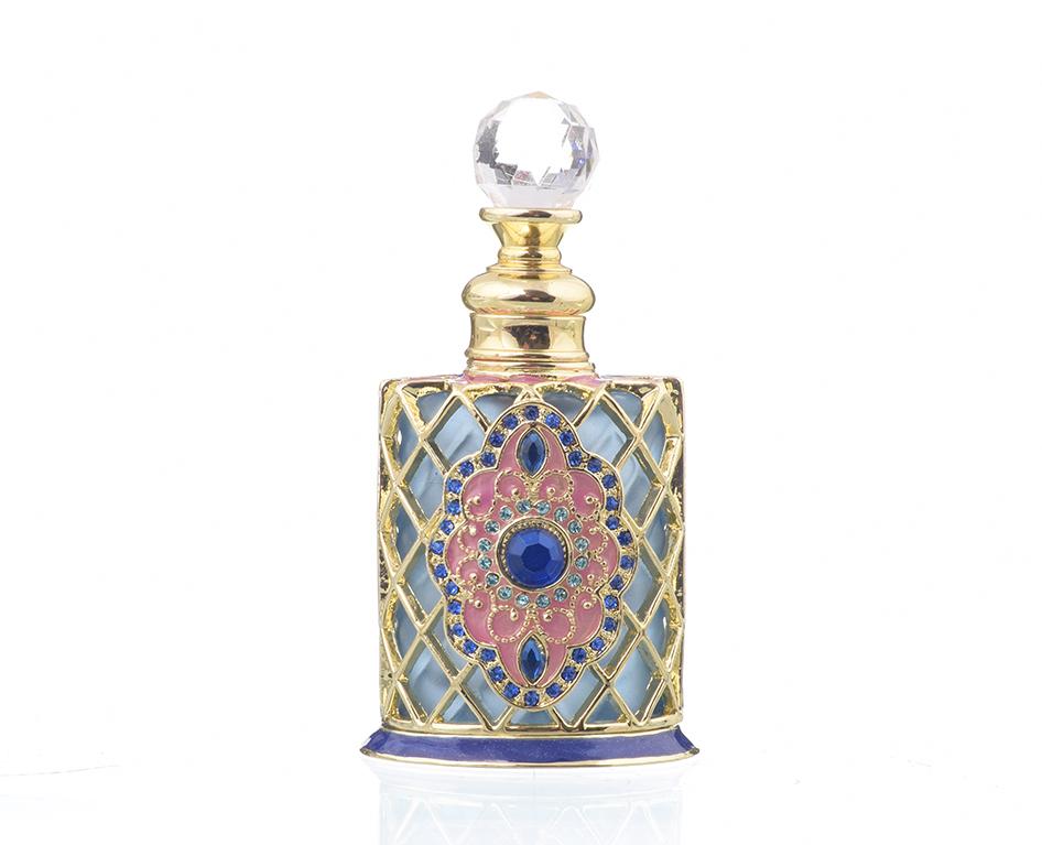 A beautifully decorated perfume bottle with enamel painting and Austrian crystals, showcasing intricate craftsmanship and luxurious gold plating.