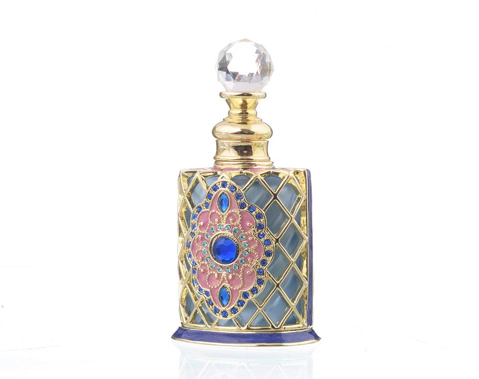 A beautifully decorated perfume bottle with enamel painting and Austrian crystals, showcasing intricate craftsmanship and luxurious gold plating.