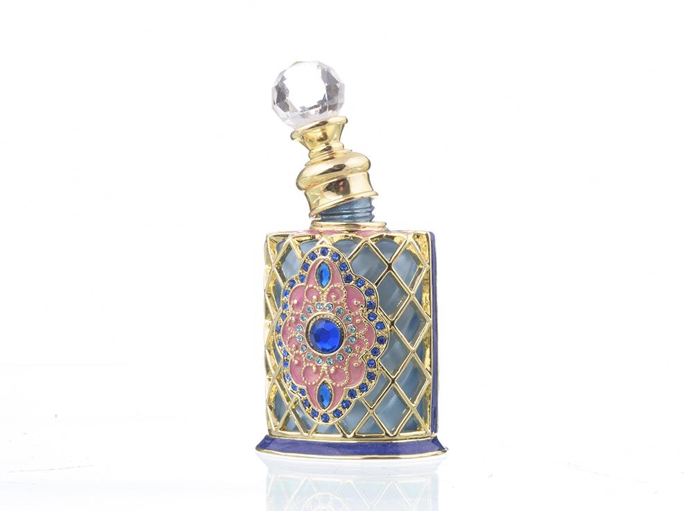 A beautifully decorated perfume bottle with enamel painting and Austrian crystals, showcasing intricate craftsmanship and luxurious gold plating.