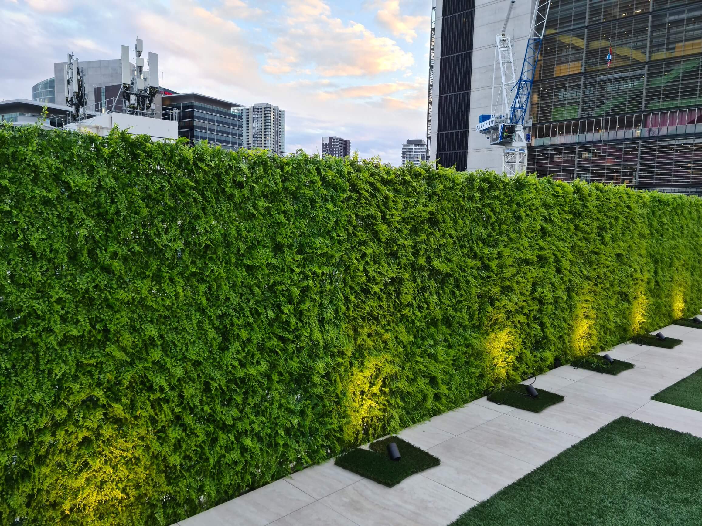 Dense Fern Artificial Hedge panel showcasing realistic green foliage, perfect for creating a lush vertical garden.