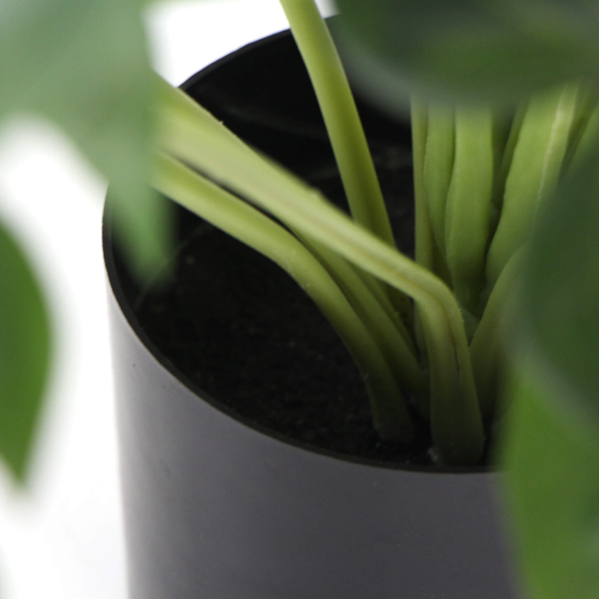 Dense Potted Artificial Split Philodendron Plant with realistic leaves in a stylish white pot, perfect for indoor decor.